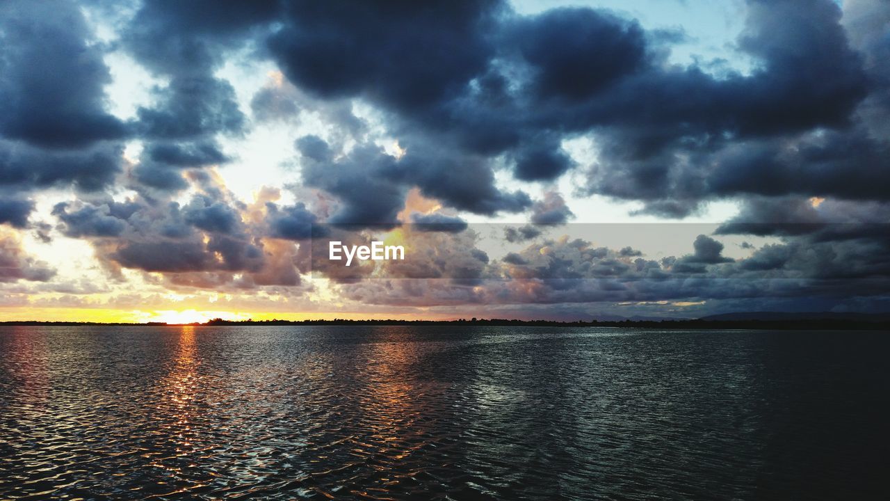 VIEW OF SEA AGAINST CLOUDY SKY