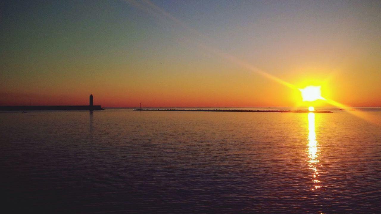 Scenic view of sunset over sea