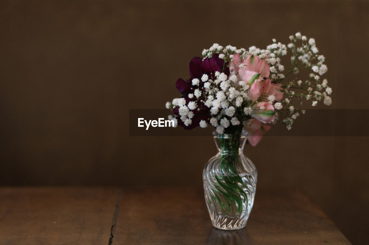 Close-up of flower vase on table