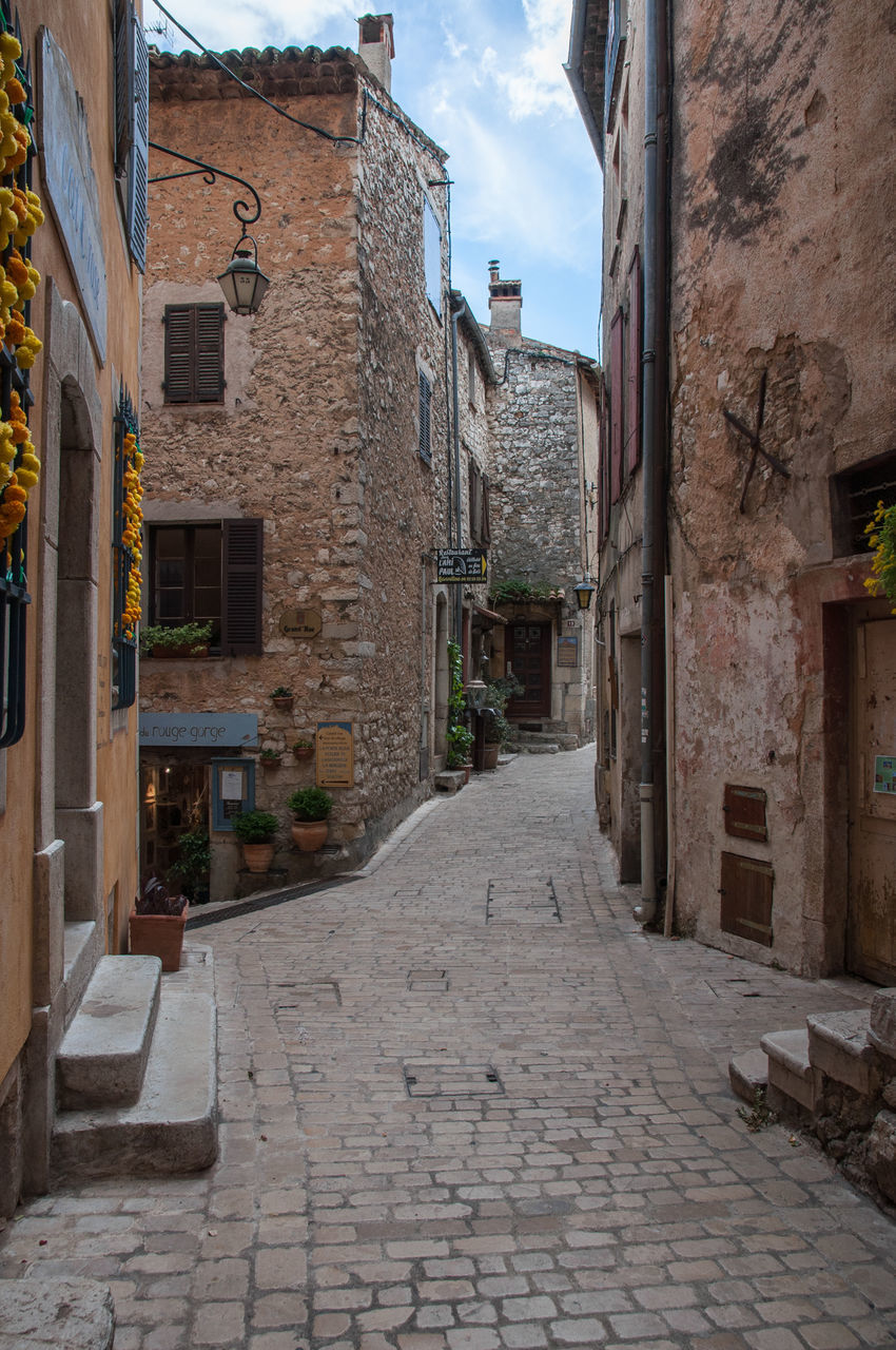 Narrow alley amidst buildings in town