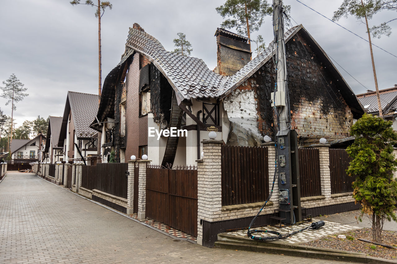 Destroyed buildings on the streets of irpen. broken windows. buildings after being hit by missiles.