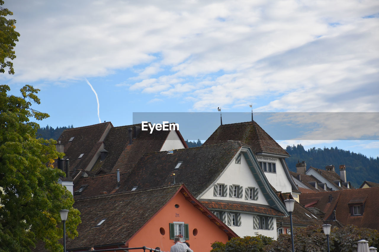 House-tops of traditional swiss houses with blue sky