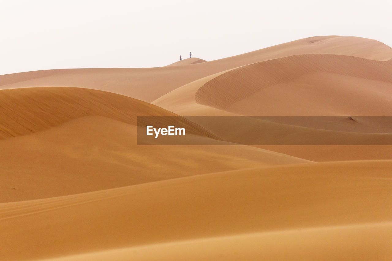 Scenic view of desert against clear sky