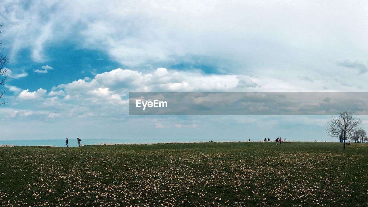 Scenic view of landscape against cloudy sky