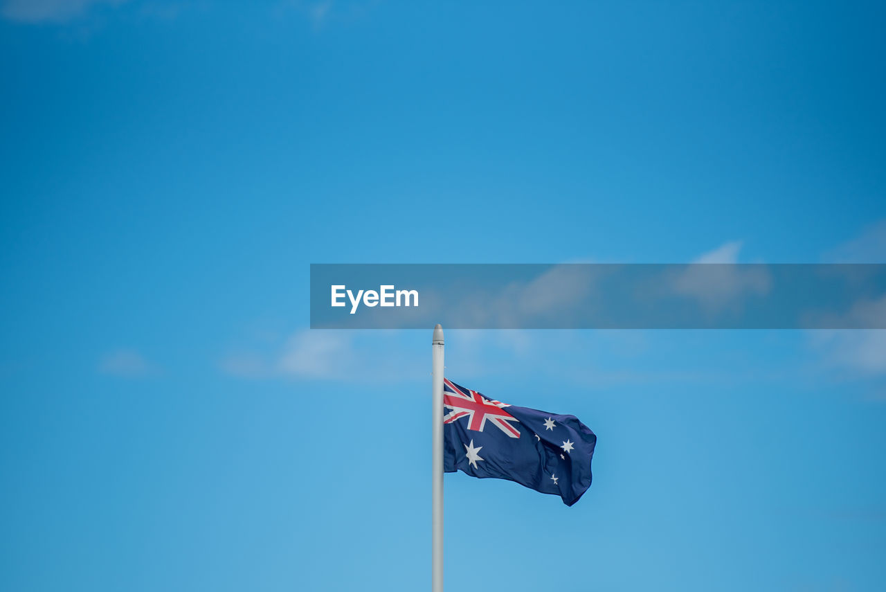 LOW ANGLE VIEW OF FLAG AGAINST SKY