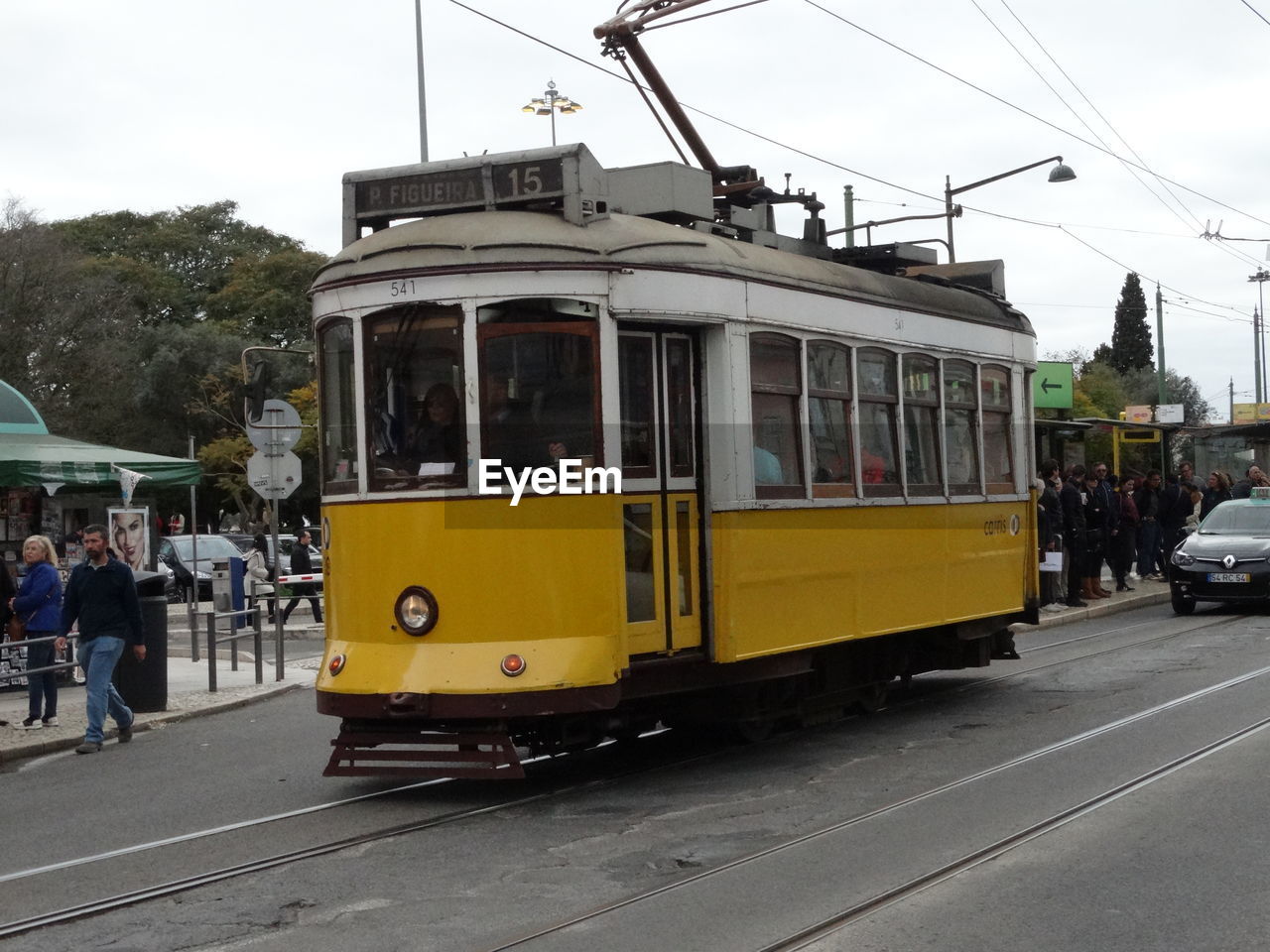 YELLOW CAR ON CITY STREET