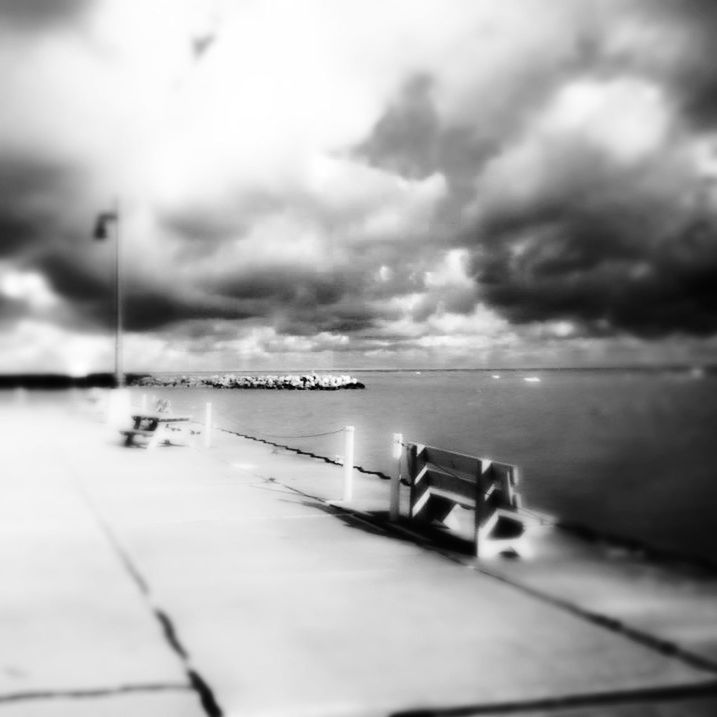 VIEW OF EMPTY ROAD AGAINST CLOUDY SKY