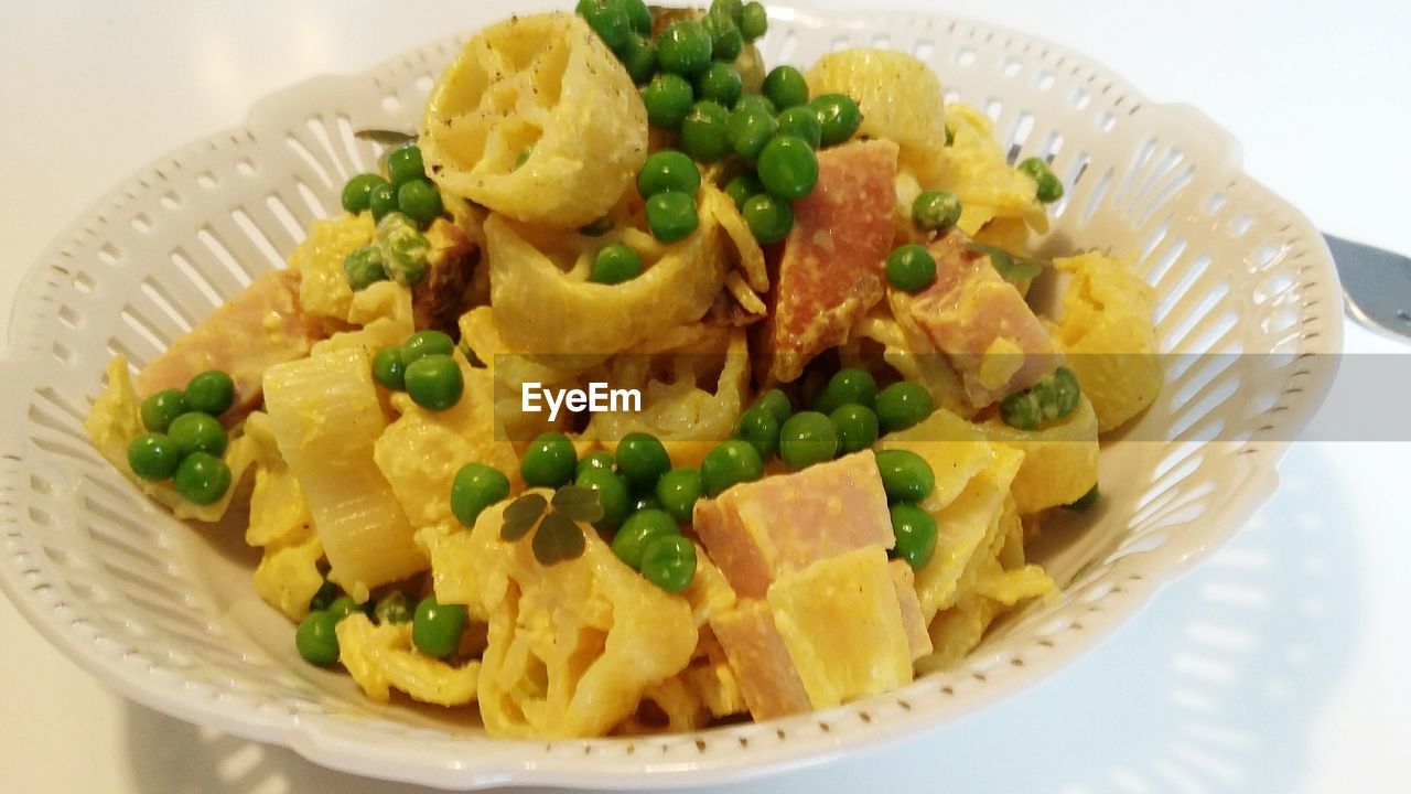 CLOSE-UP OF PASTA WITH SALAD