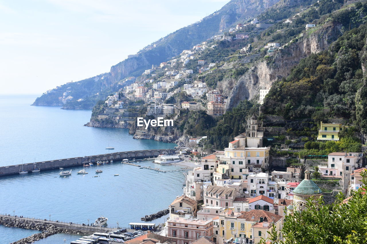 High angle view of townscape by sea