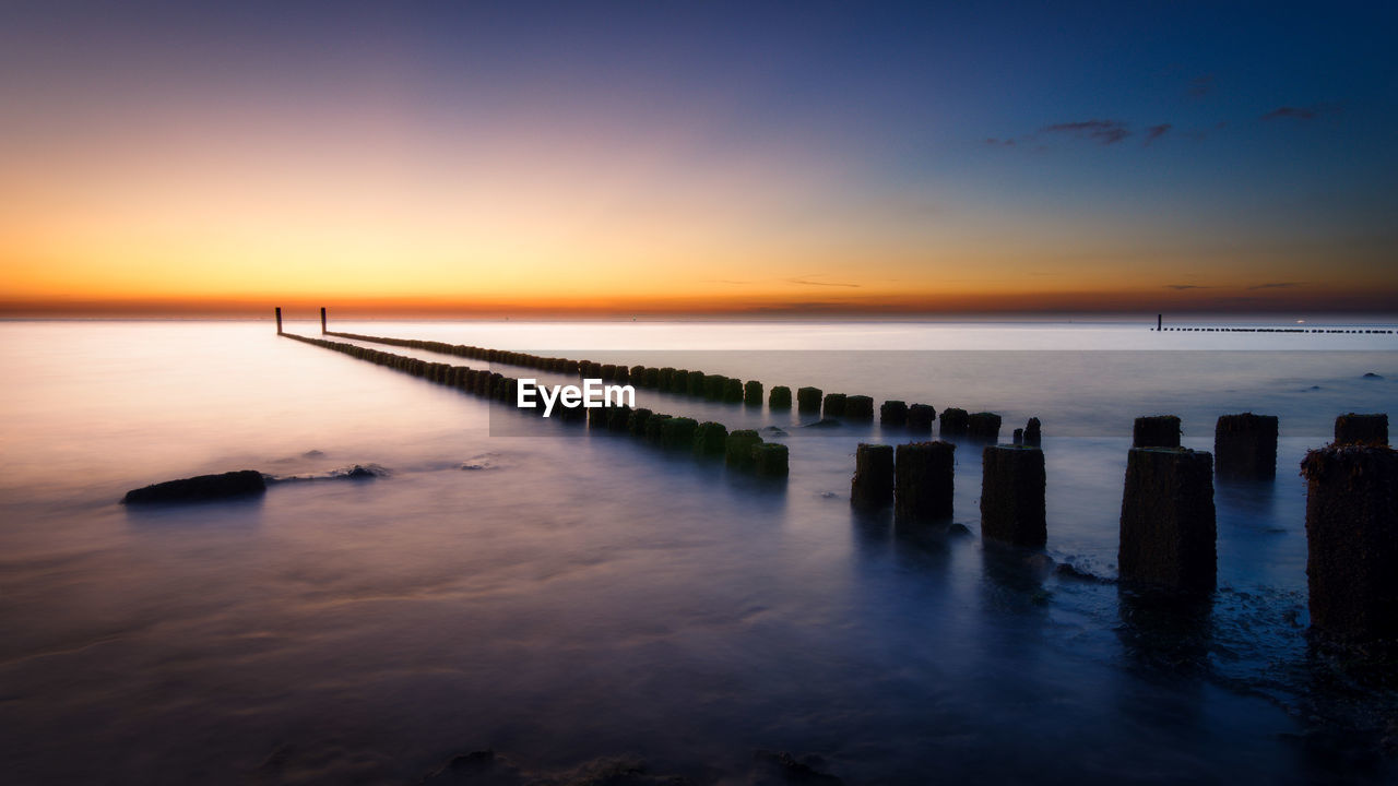 Scenic view of sea against sky during sunset