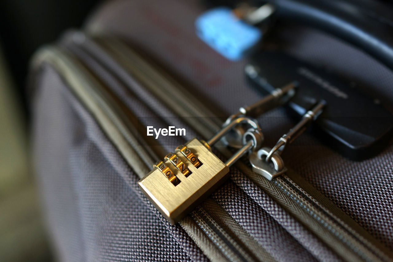 Close-up of padlock on suitcase