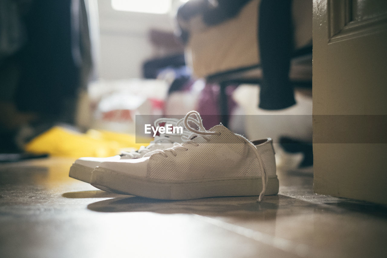 Close-up of canvas shoes on floor