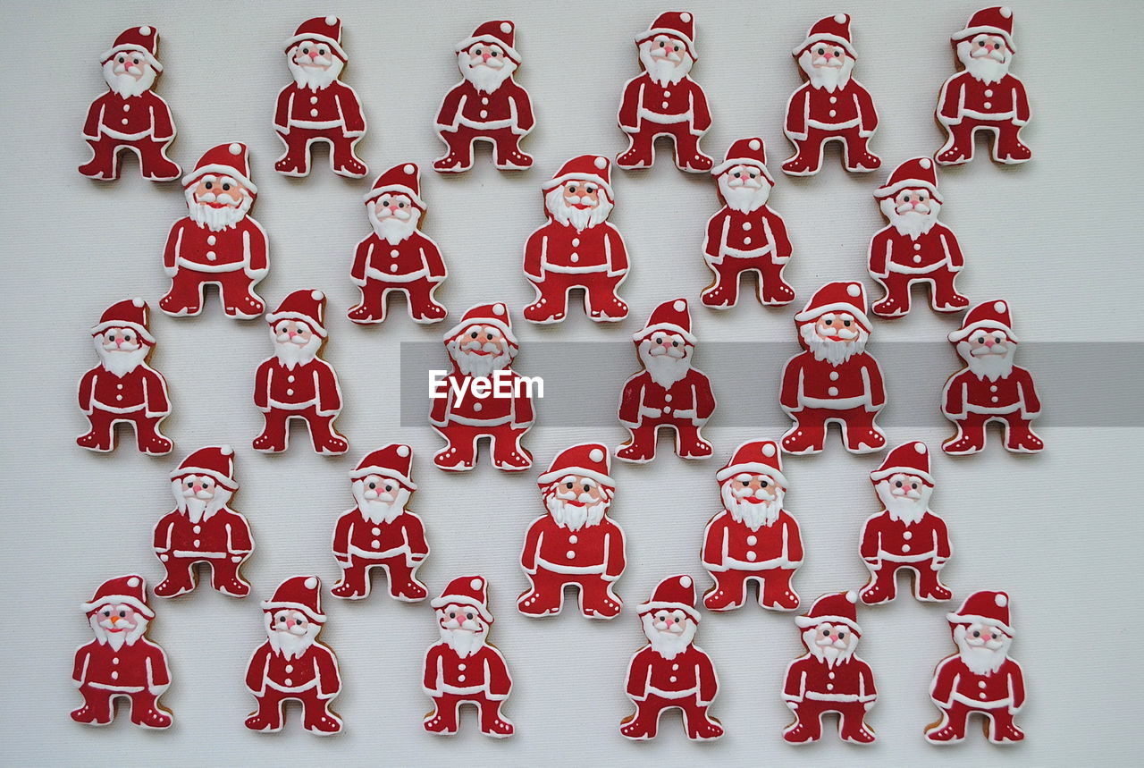 High angle view of santa claus cookies on white background