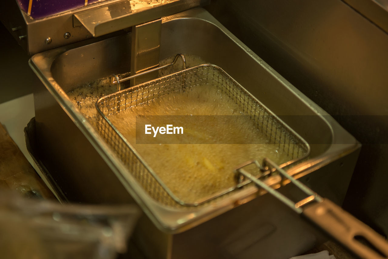 High angle view of french fries preparing in restaurant