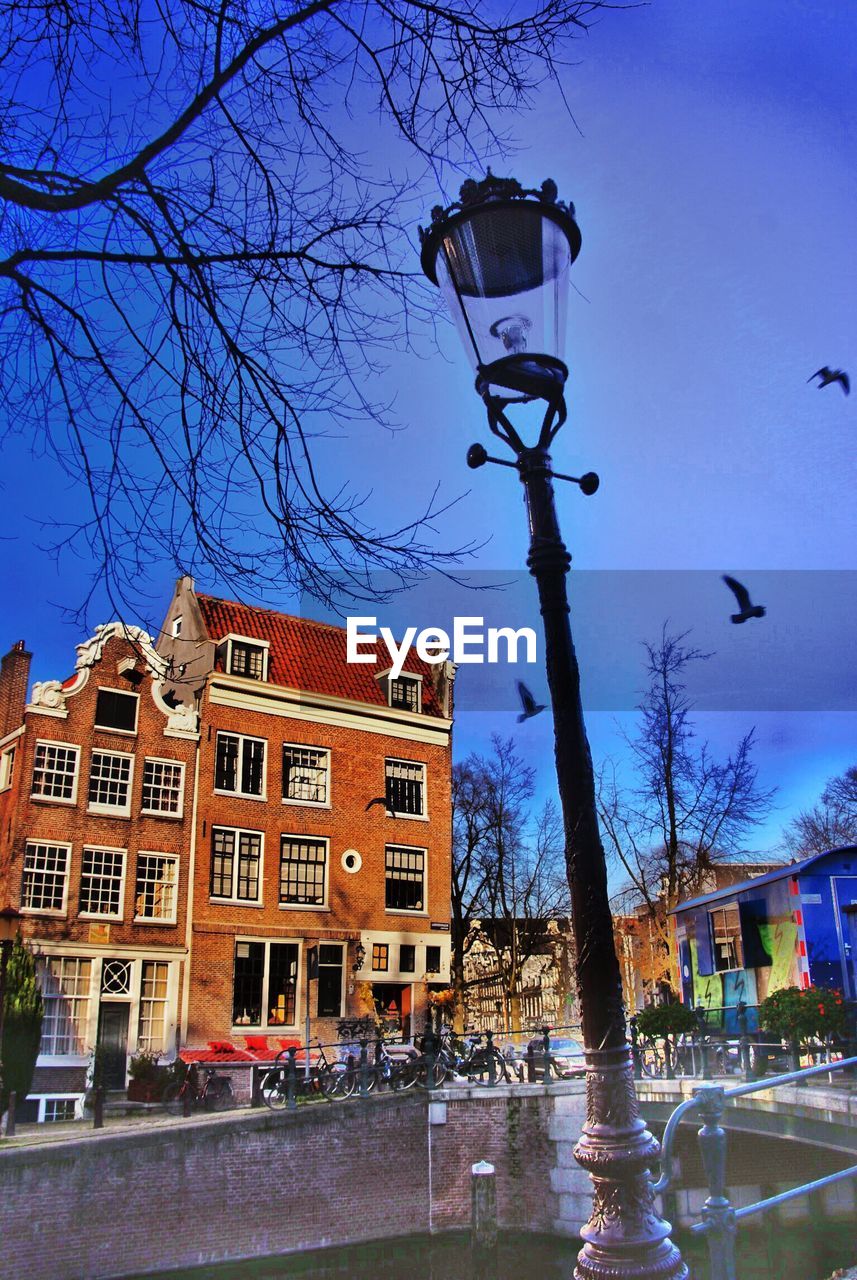 VIEW OF BUILDINGS AGAINST BLUE SKY