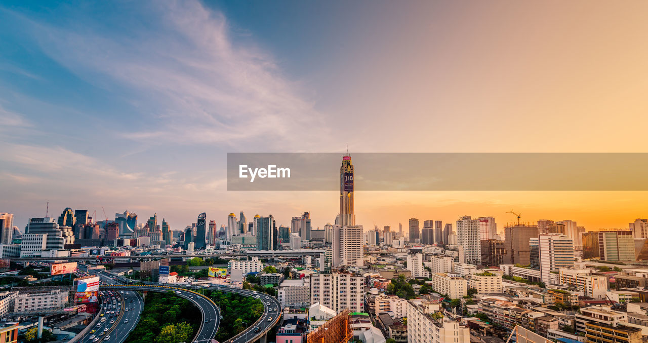Aerial view of city buildings during sunset