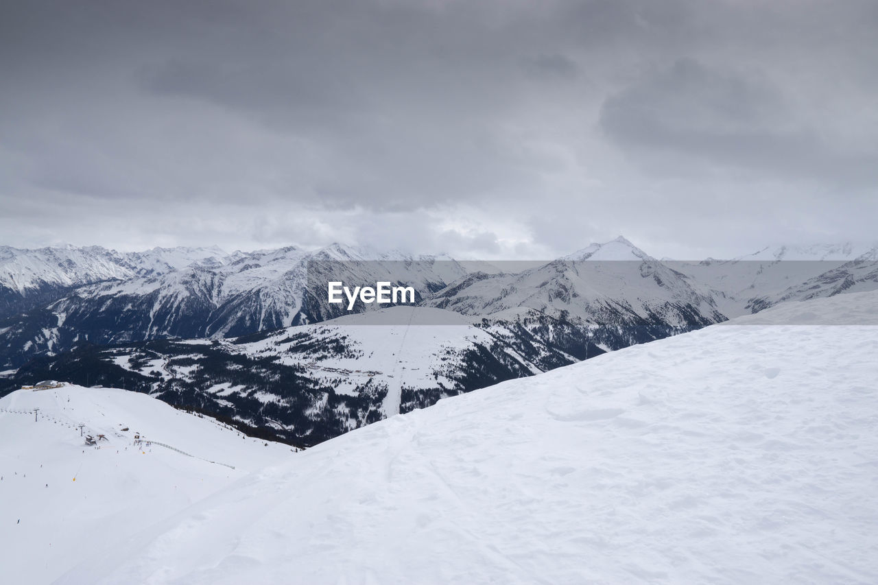 SNOW COVERED MOUNTAIN AGAINST SKY