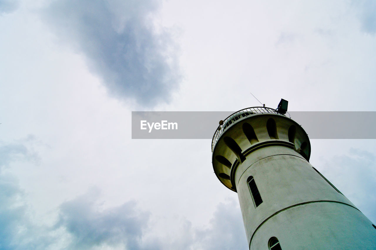 LOW ANGLE VIEW OF TOWER AGAINST CLOUDY SKY