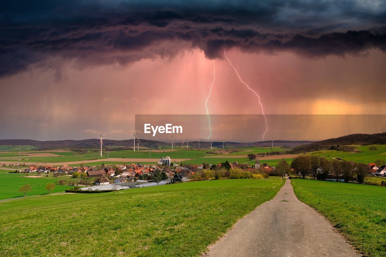 Panoramic view of lightning over field