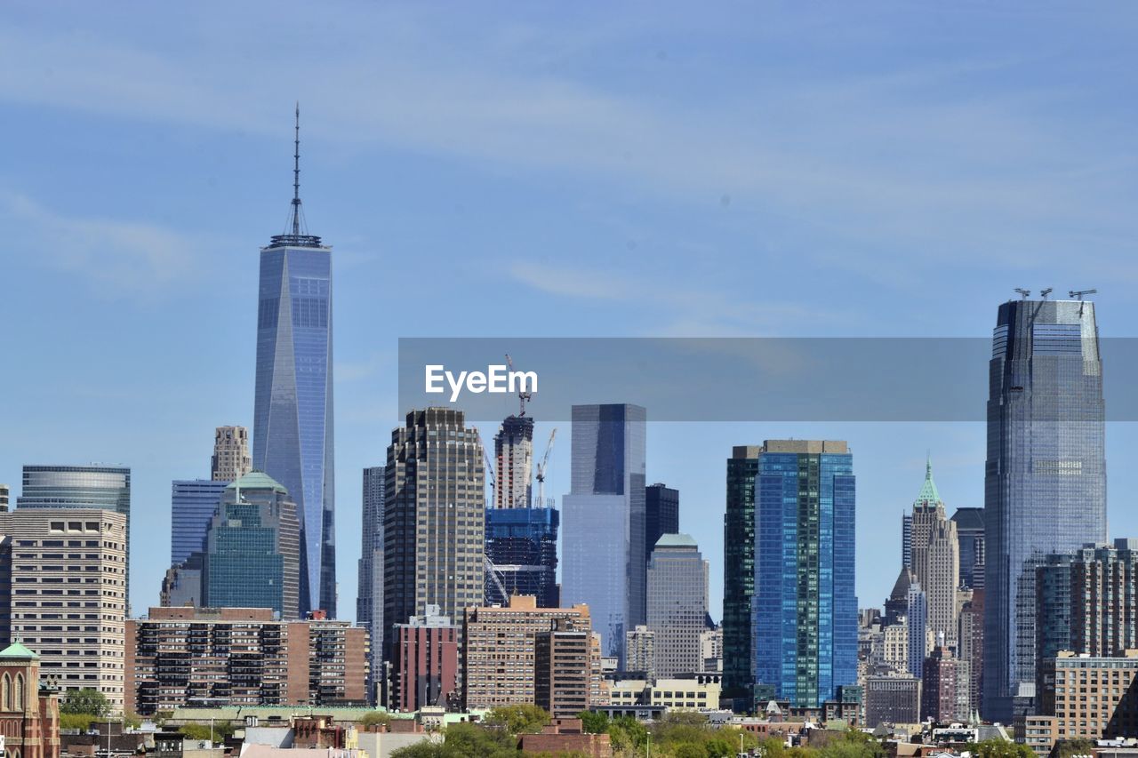 VIEW OF SKYSCRAPERS IN CITY AGAINST SKY