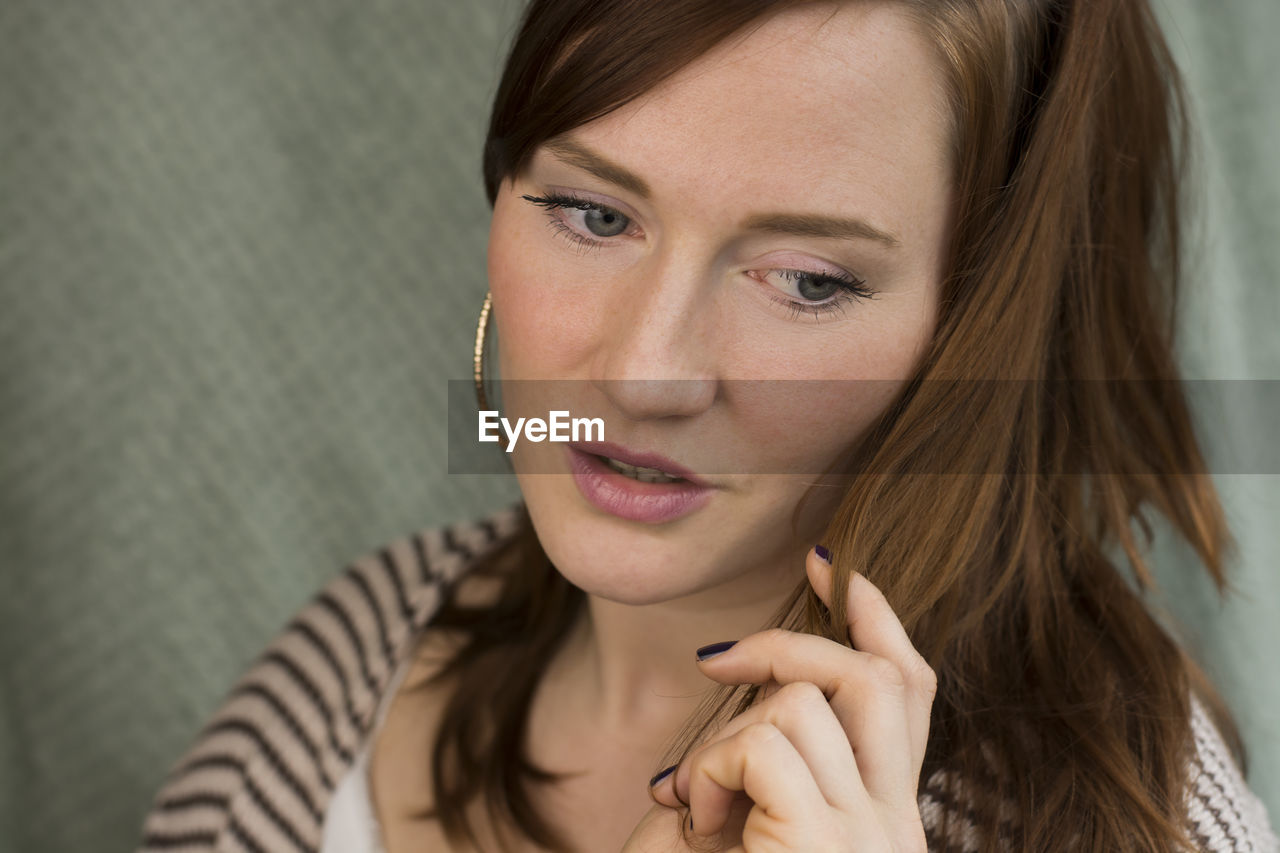 Close-up of thoughtful young woman looking away