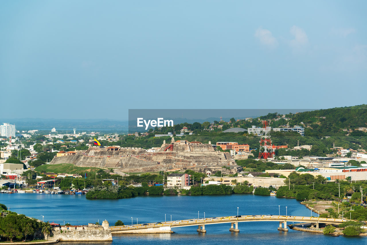 View of cityscape against blue sky