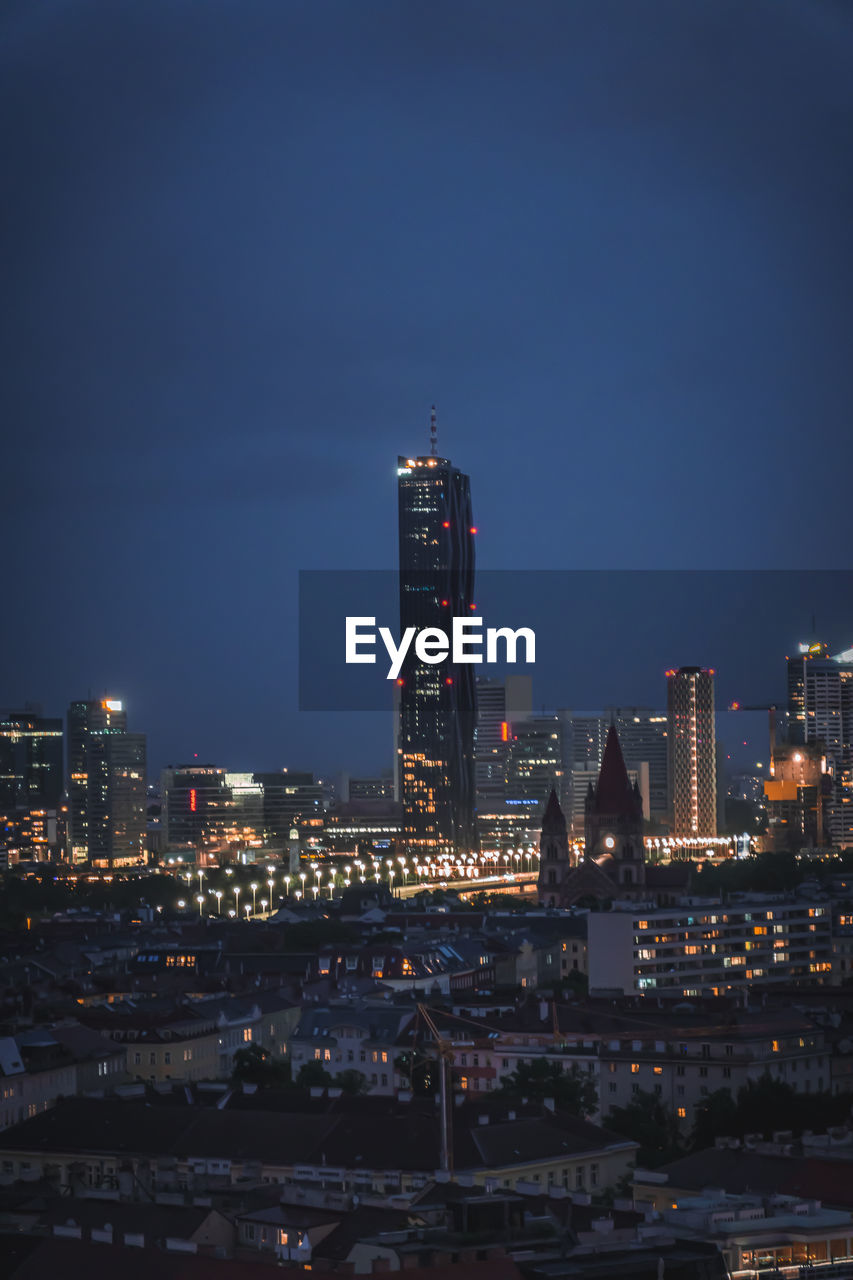 Illuminated buildings in city at night