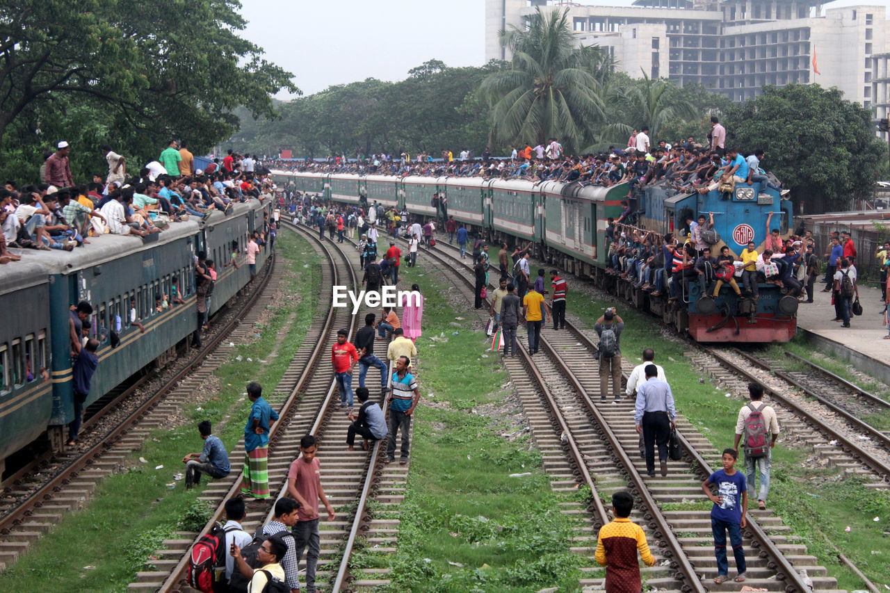 High angle view of people on railroad tracks