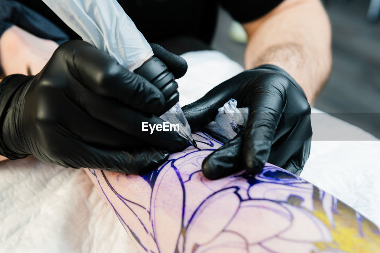 protection, protective workwear, adult, protective glove, hand, glove, indoors, occupation, arm, men, skill, security, clothing, tattooing, close-up, one person, limb, expertise, working