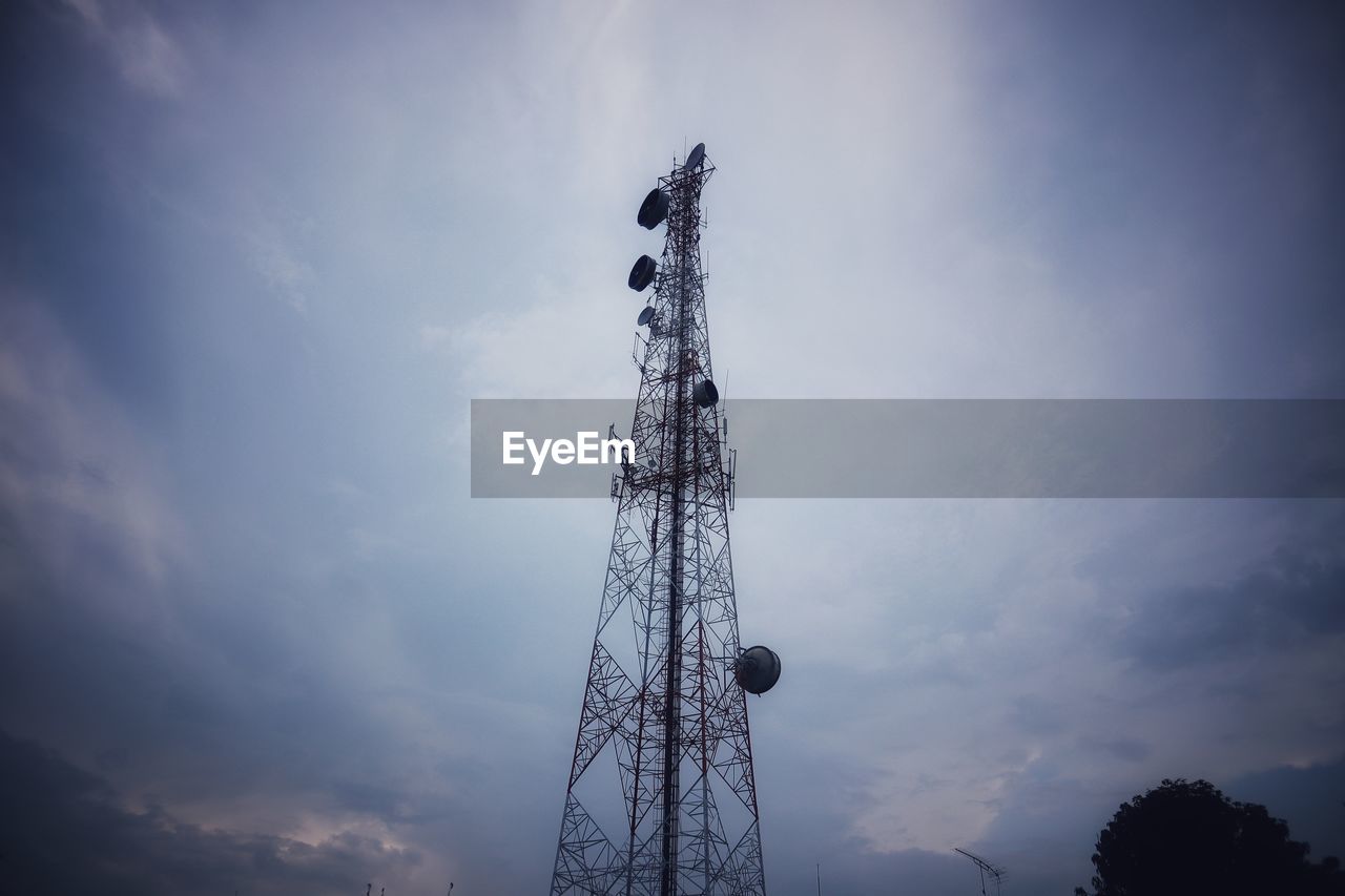 Low angle view of communications tower against sky