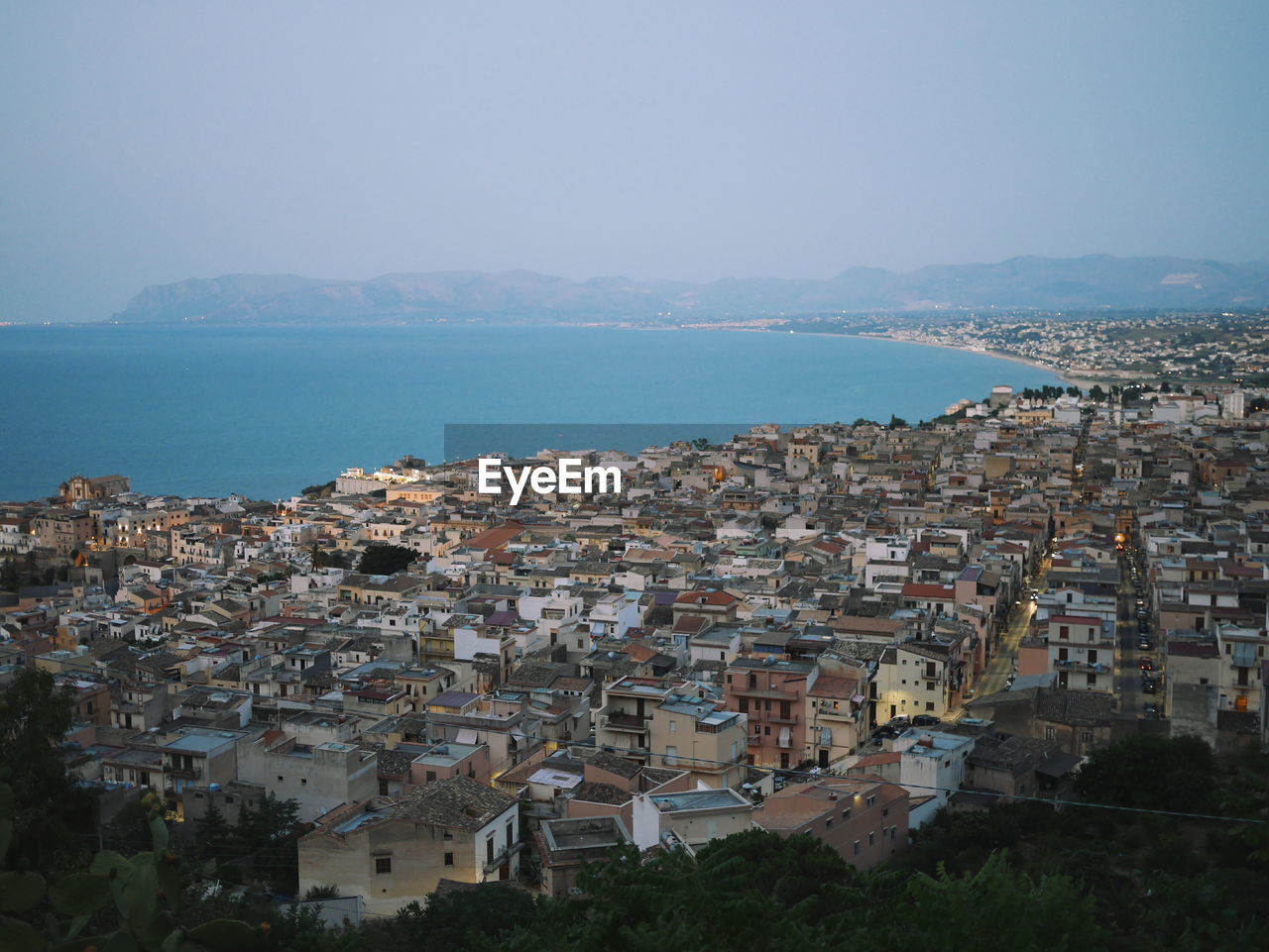 High angle view of castellammare del golfo by sea against sky