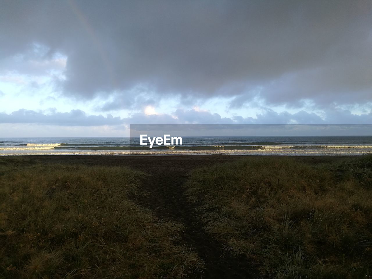 BEACH AGAINST SKY