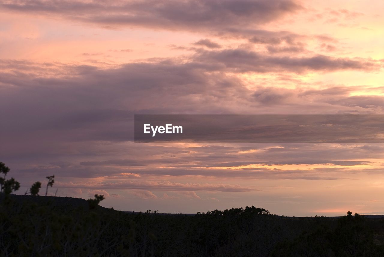 SUNSET OVER LANDSCAPE