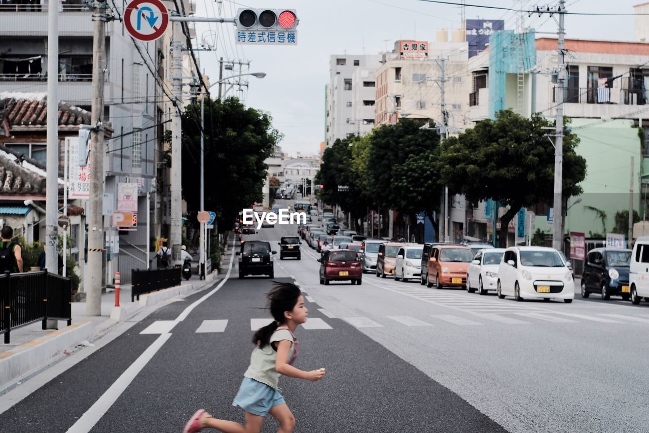 MAN WALKING ON ROAD