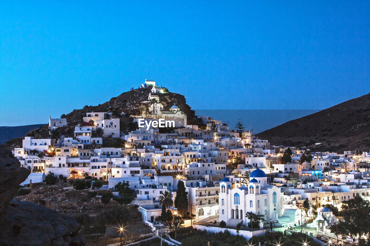 Chora in greek cyclade island of ios village at blue hour, greece