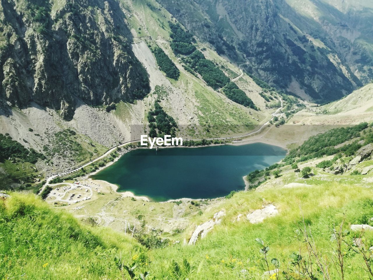 Scenic view of lake amidst mountains