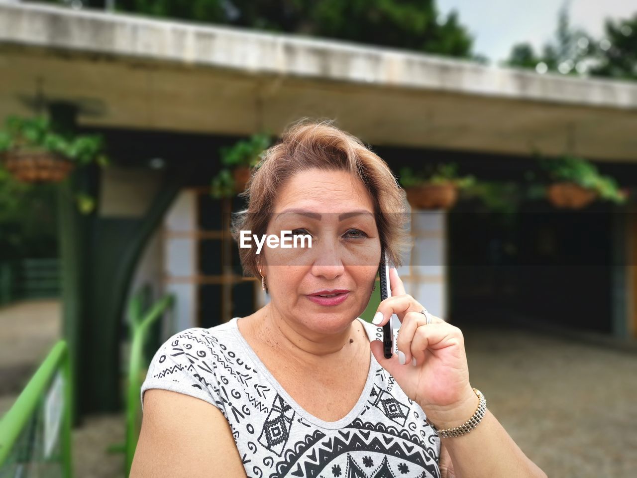 Portrait of woman talking on mobile phone