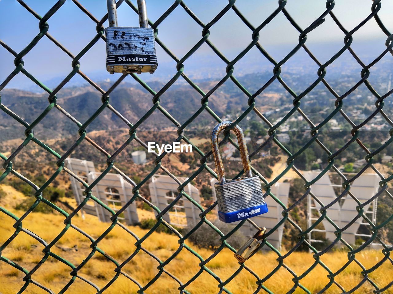 TEXT ON CHAINLINK FENCE WITH CHAIN