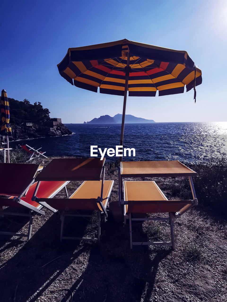 DECK CHAIRS ON BEACH