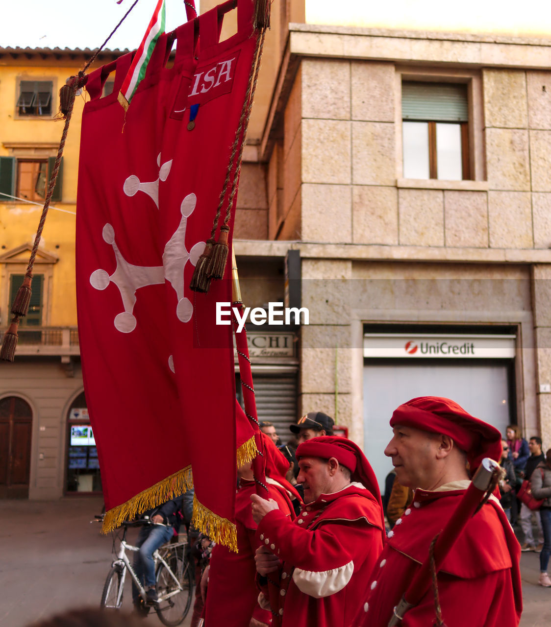 FULL LENGTH OF PEOPLE STANDING ON RED CITY