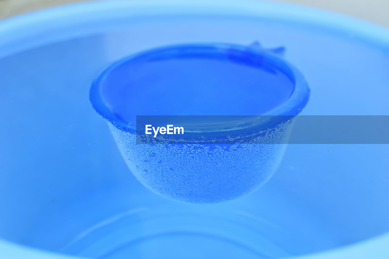 High angle view of water in blue bucket