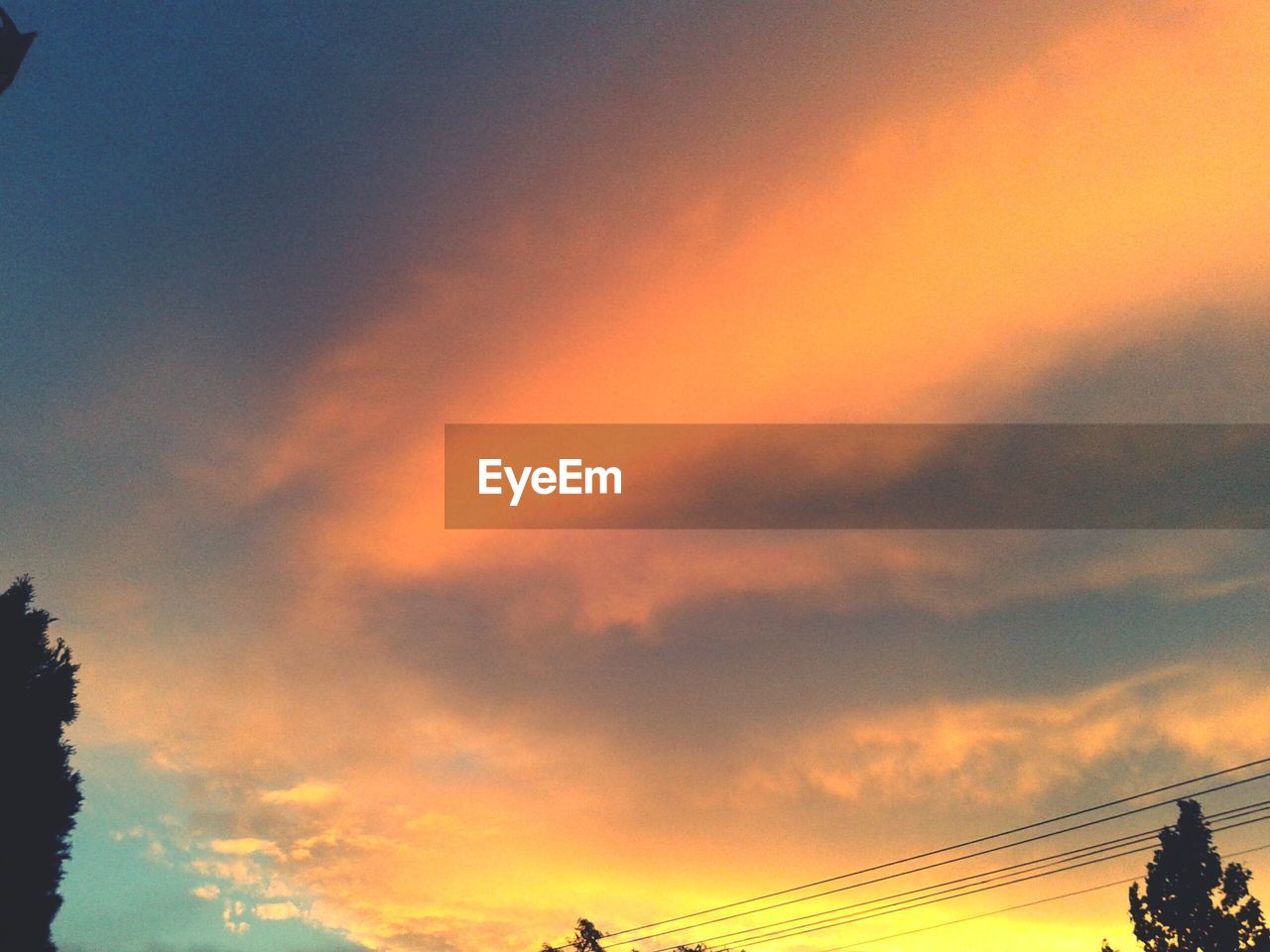 Low angle view of cloudy sky during sunset