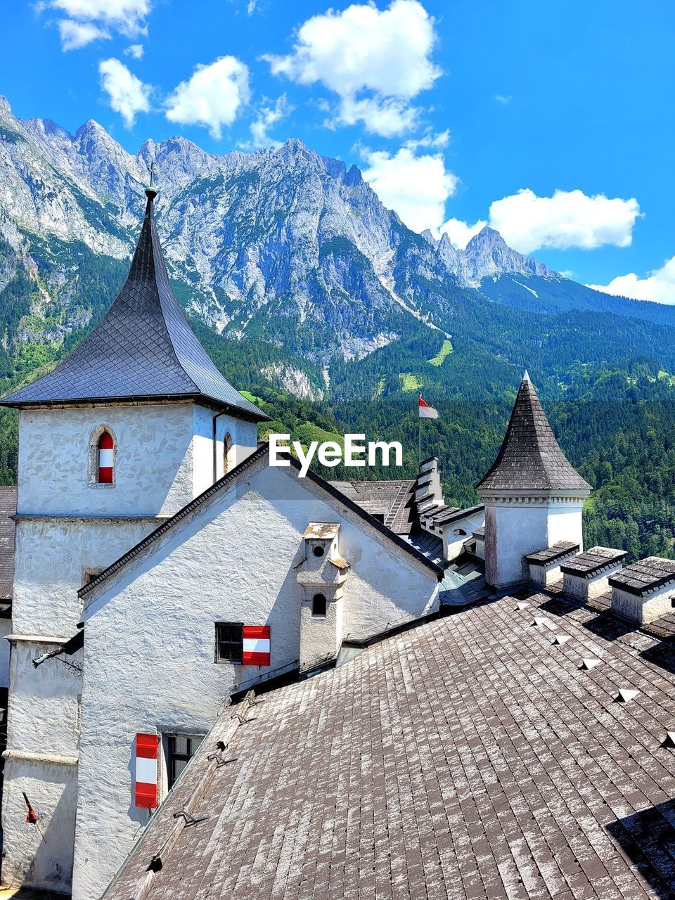 Castle and mountains against sky
