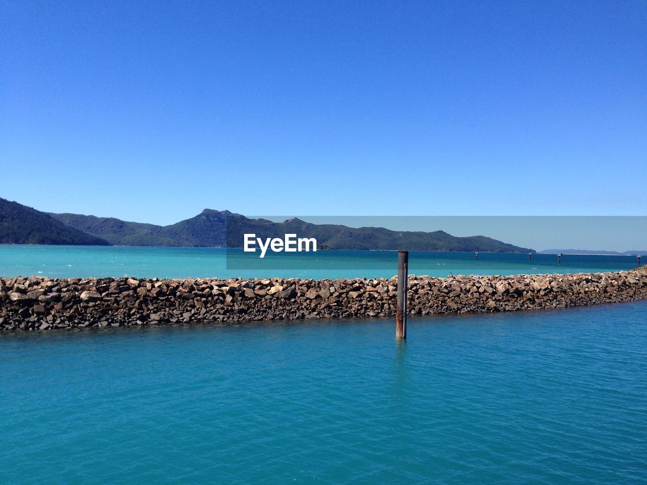 Scenic view of calm sea against clear sky