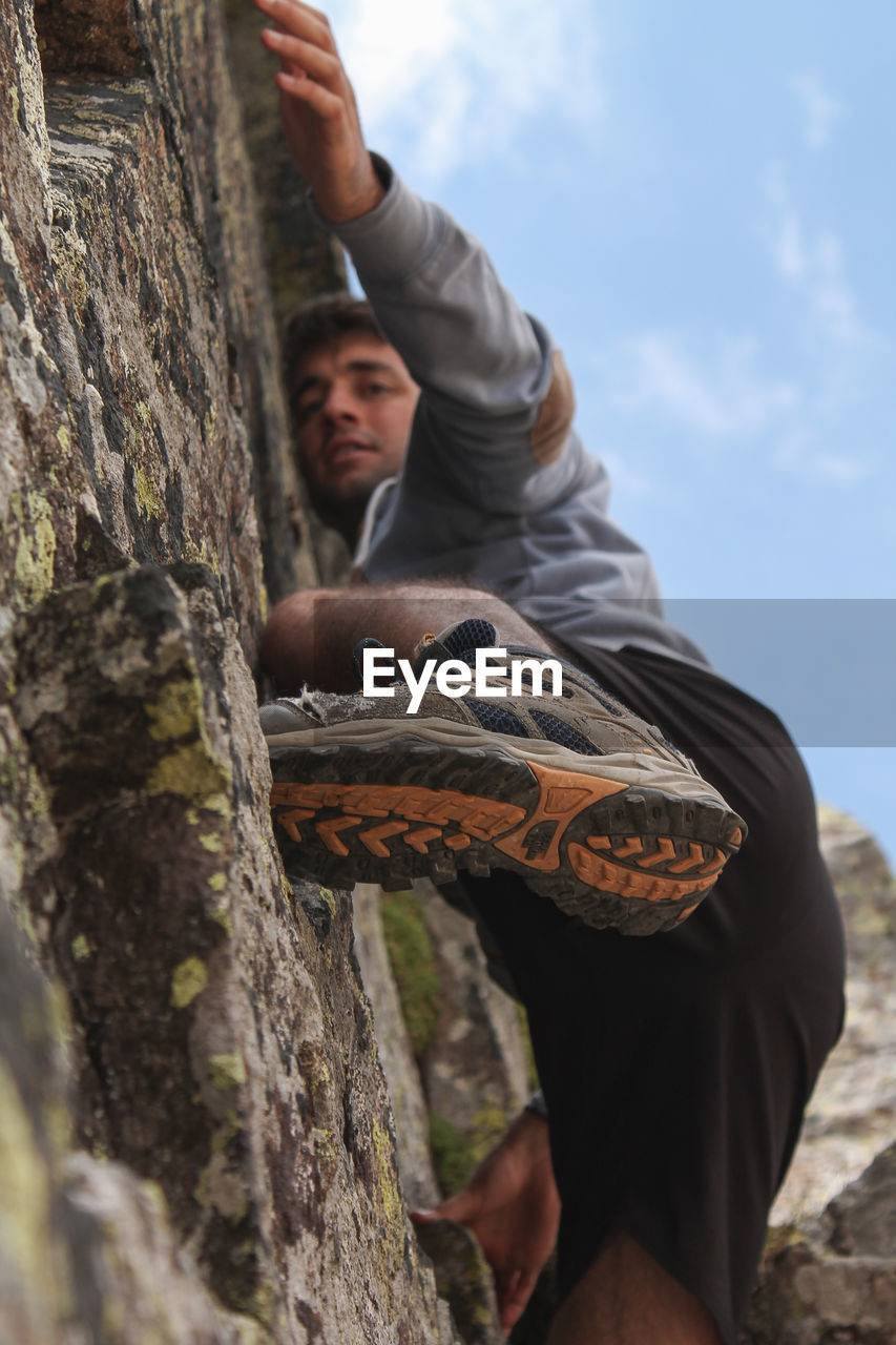 Man climbing wall