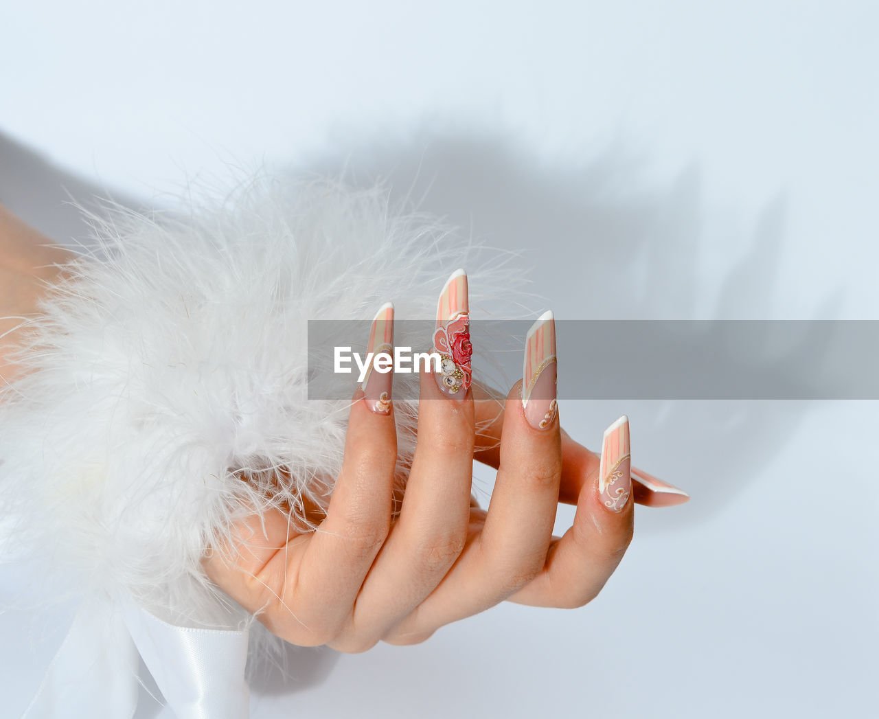 Close-up of woman hand on white background