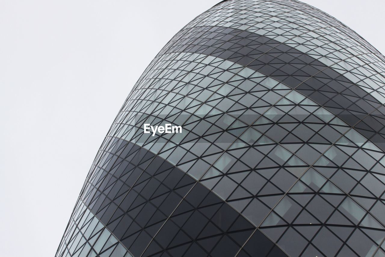 Low angle view of skyscraper against clear sky