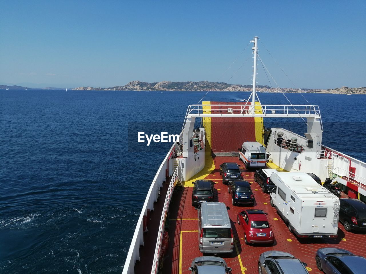 Ship sailing on sea against clear sky