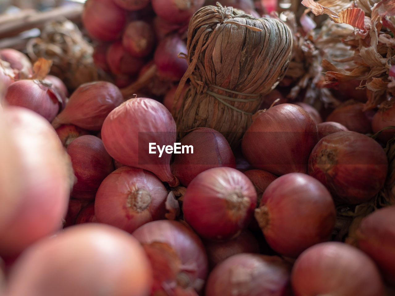 Full frame shot of onions in market