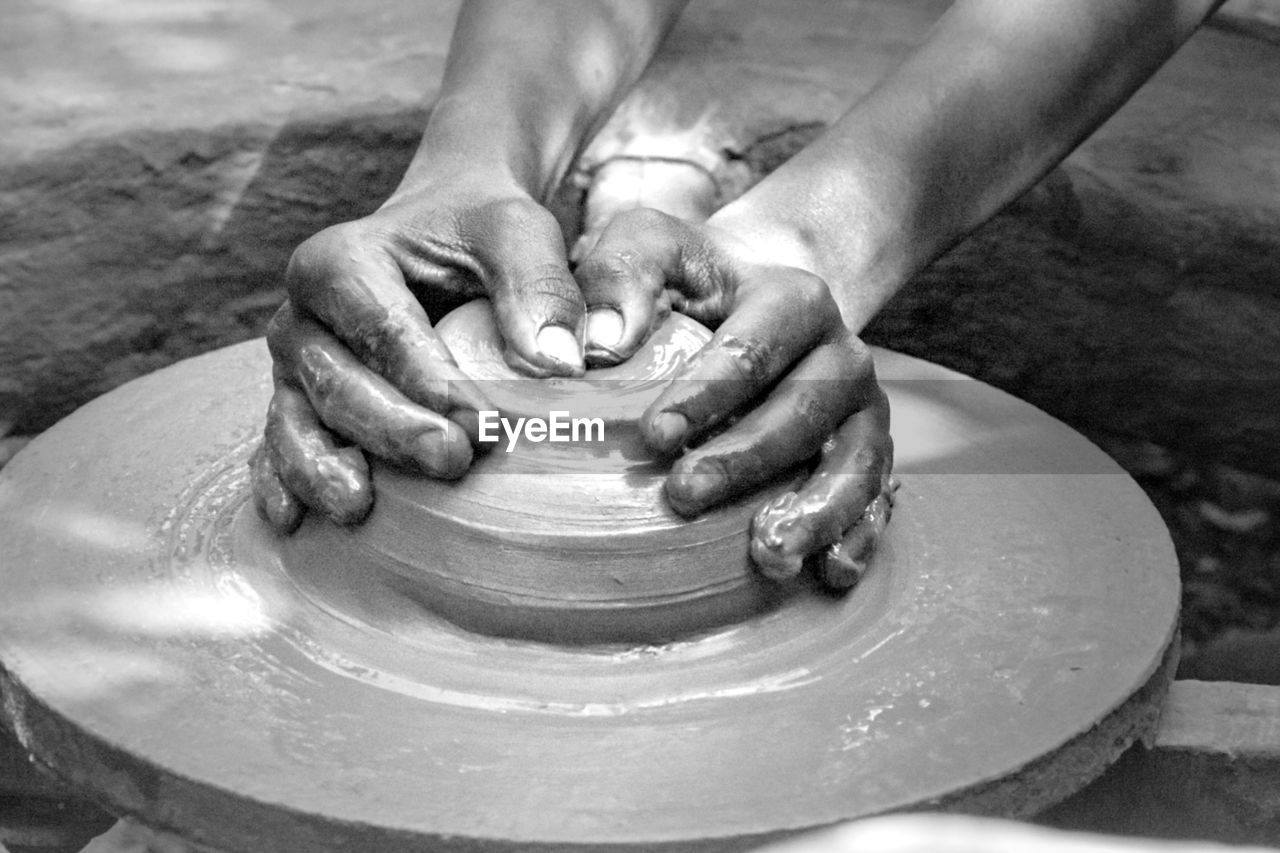 potter's wheel, hand, pottery, art, clay, wheel, craft, spinning, skill, molding a shape, making, black and white, occupation, working, creativity, earthenware, craftsperson, shape, expertise, mud, ceramic, monochrome, motion, workshop, one person, monochrome photography, dirt, close-up, sculpture